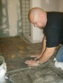 Installing a natural stone tile bathroom floor